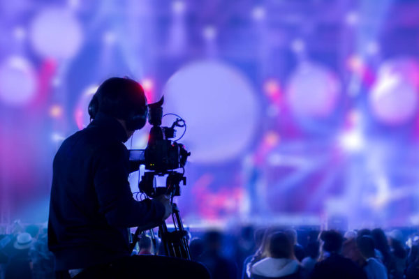 The Filmmaker Is Recording and Broadcasting Live Concerts on Camcorders.